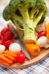 Healthy food concept. Fresh organic vegetables on the red polka-dot background. Ingredients for cooking. Close up. Top view.