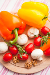 Healthy food concept. Fresh organic vegetables on the red polka-dot background. Ingredients for cooking. Close up. Top view.