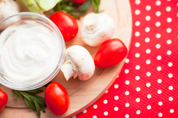 Healthy food concept. Fresh organic vegetables on the red polka-dot background. Ingredients for cooking. Close up. Top view.