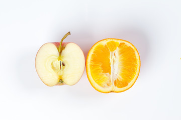red apple orange fruit slice half on white background