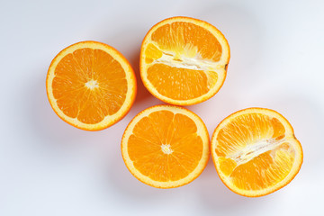 Orange Fruit half cut slices top view white background