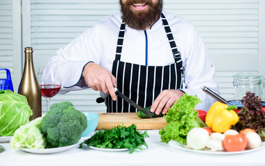 Chef man in hat. Secret taste recipe. Dieting and organic food, vitamin. Healthy food cooking. Vegetarian. Mature chef with beard. Bearded man cook in kitchen, culinary. vegetable allergen