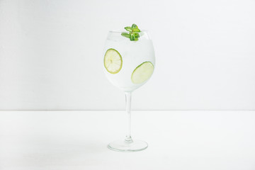 Martini royale cocktail in wine glass with lime and mint. Selective focus. Shallow depth of field.