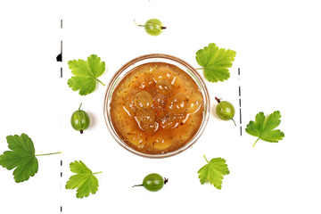 gooseberry jam on white wooden background