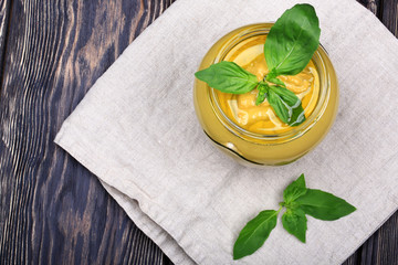 pesto sauce on wooden background