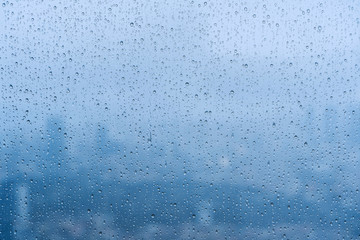 raindrops on the window glass blue