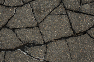 old cracked asphalt close up