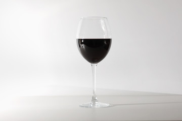 Glass of red wine isolated on white background. A glass of red wine. Copy space. Concept restaurant, alcohol, party.