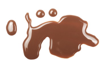 Chocolate milk puddle isolated on white background, top view