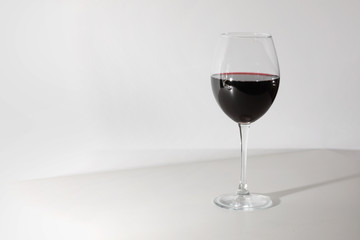 Glass of red wine isolated on white background. A glass of red wine. Copy space. Concept restaurant, alcohol, party.