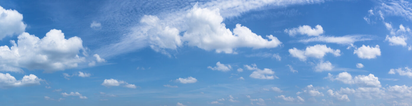 Panorama or panoramic photo of blue sky and clouds or cloudscape.
