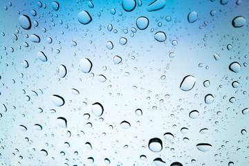 Water or rain in front of mirror of car.