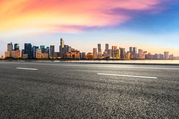 Empty asphalt road through Hangzhou business district