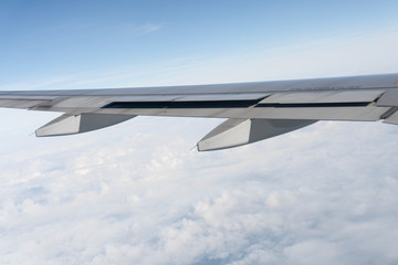 Plane wings are in the atmosphere