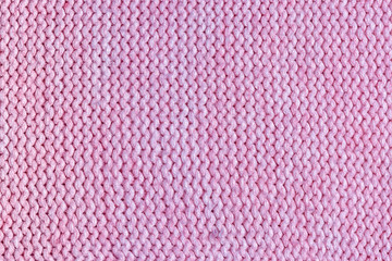 Texture, pink knitted jersey close up. Blank wool background.