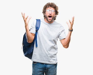 Handsome hispanic student man wearing backpack and glasses over isolated background crazy and mad...