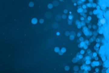light blue shiny sparkles one side frame bokeh texture - wonderful abstract photo background