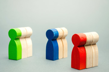 Groups of multicolored wooden people. The concept of market segmentation. Target audience, customer...