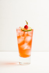 Sweet raspberry cocktail with lime slice. Selective focus. Shallow depth of field. 