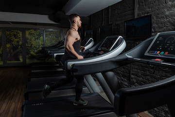 athlete takes strength training in the gym