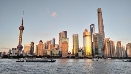 night view of the modern Pudong skyline across the Bund in Shanghai, China. Shanghai is the largest Chinese city