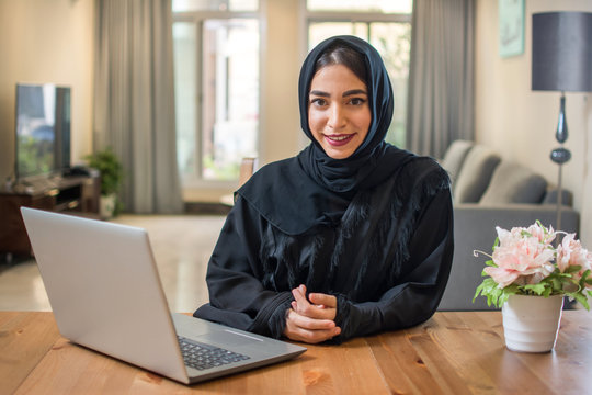 Young Arabic Business Woman Wearing Hijab With Laptop At Home