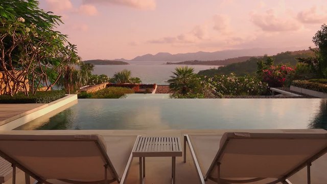 Loopable Cinemagraph of Two Sunbeds on Luxury Terrace with Sea View