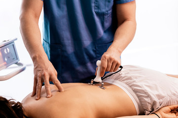 Physiotherapist giving backstroke therapy to a woman