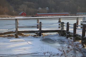 A pier on river in ice