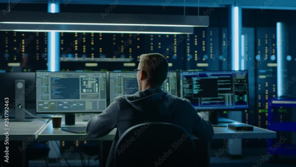 Aufkleber IT Specialist Working on Personal Computer with Monitors Showing Coding Language Program, He Celebrates His Success by Raising Hands in YES Gesture. Technical Room of Data Center. 