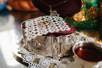 Two yellow gold wedding rings in the religious church