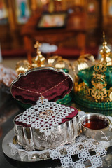 Two yellow gold wedding rings in the religious church