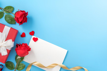Beautiful greeting invitation card, concept of mother day, Valentine day, anniversary and birthday isolated on blue color background, copy space, top view, mock up, flat lay