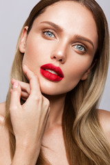 Beautiful young model with red lips isoleted on a wight background