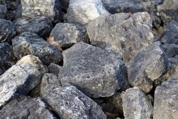 The textures of the pile of rocks and stones.