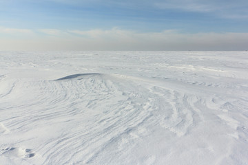 Snow  on a frozen river in winter, Obskoe Reservoir, Novosibirsk, Russia