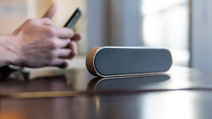 wireless speaker in use. Music lovers and modern audio technology
