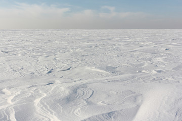 Snow  on a frozen river in winter, Ob Reservoir, Novosibirsk, Russia