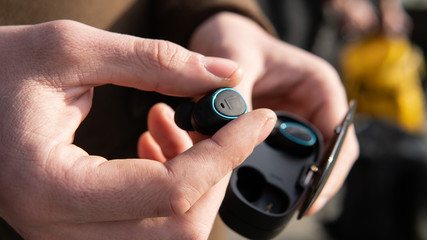 Fototapeta premium wireless headphones close-up. autonomous headphones with charging