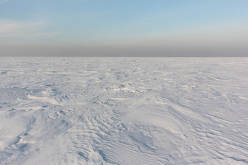 Snow  on a frozen river in winter, Ob Reservoir, Novosibirsk, Russia