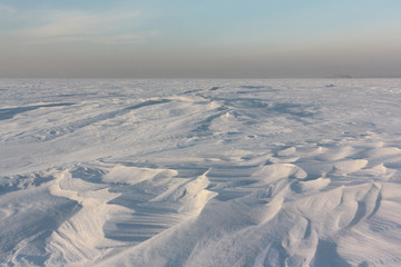 Snow  on a frozen river in winter, Ob Reservoir, Novosibirsk, Russia