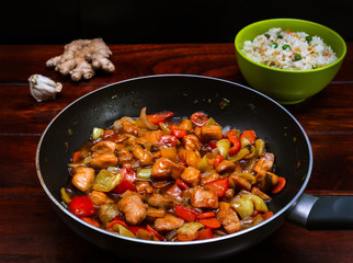 Stir fry chicken with vegetables and risee. Asian cuisine.