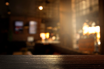 top of black wood with blur light of bar or pub party in the dark night background - obrazy, fototapety, plakaty