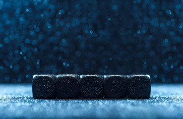 Empty five dices, on the blue background. Concept for advertising.