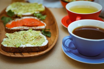 Breackfast toasts with avocado and salmon.