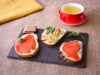 Breackfast toasts with avocado and salmon.