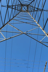 Fototapeta premium Low Angle View Of Electricity Pylon Against Clear Blue Sky