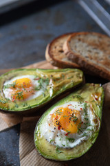 Baked avocado with egg and toast