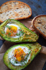 Baked avocado with egg and toast