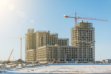 Residential complex real estate, under construction areas with high cranes